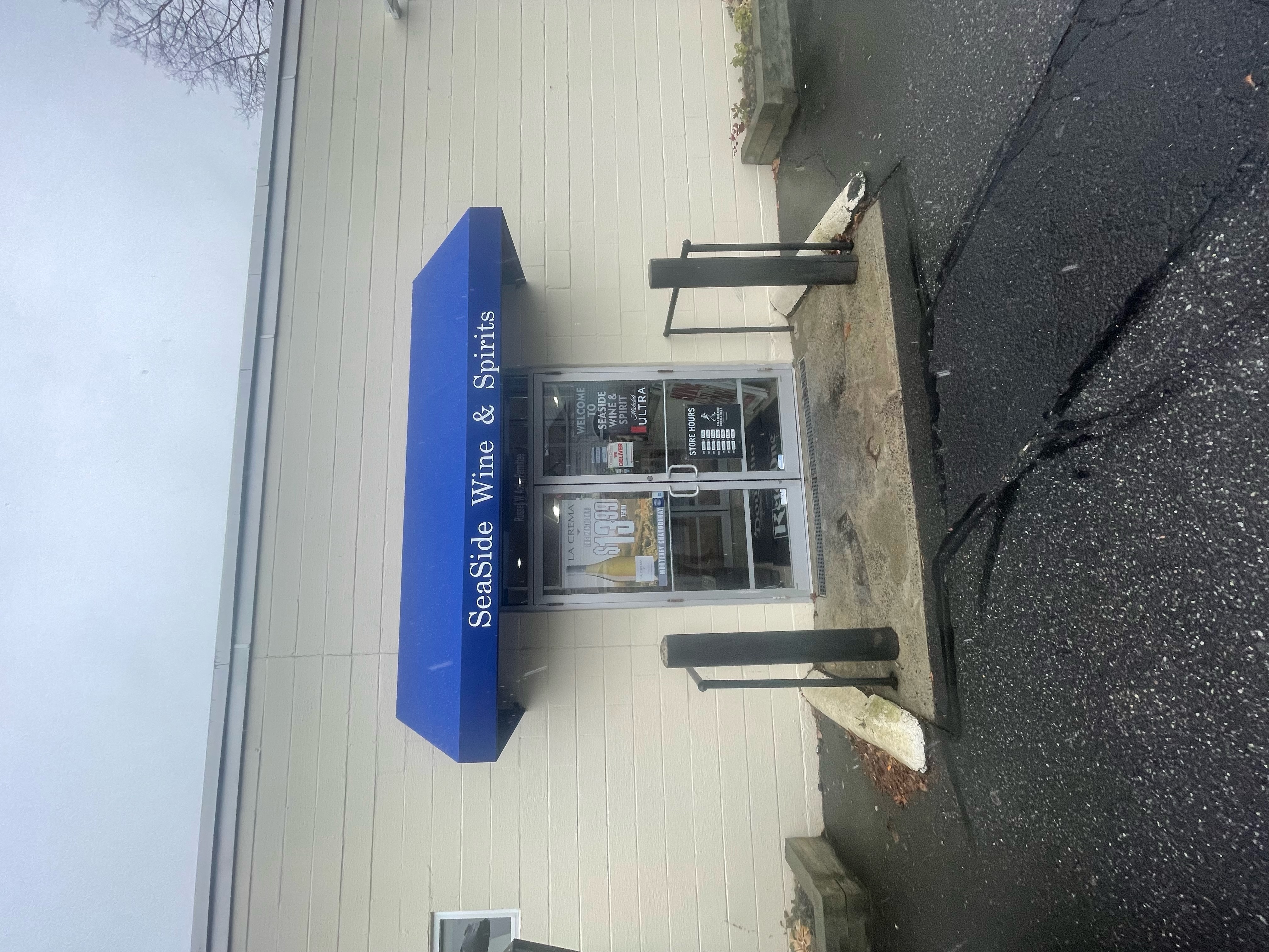 SeaSide Wine & Spirits custom blue door awning