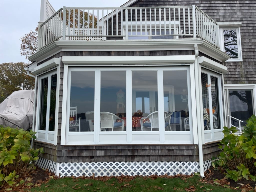 The same bay window with the shutters rolled up — the housings all but disappear
