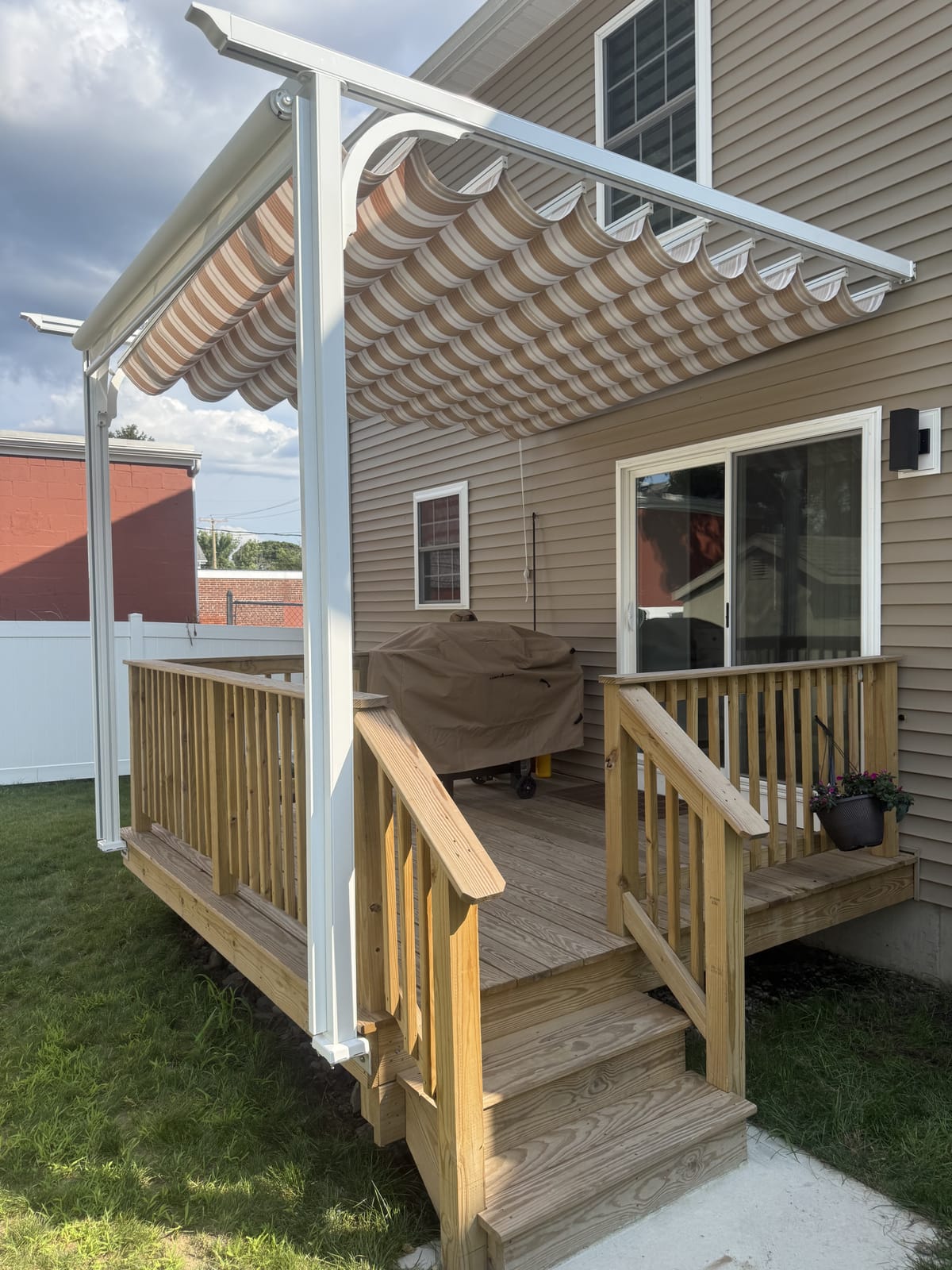 Slide-wire canopy pergola with privacy screen up