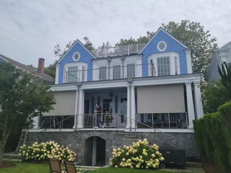 Custom roll curtains on a coastal home