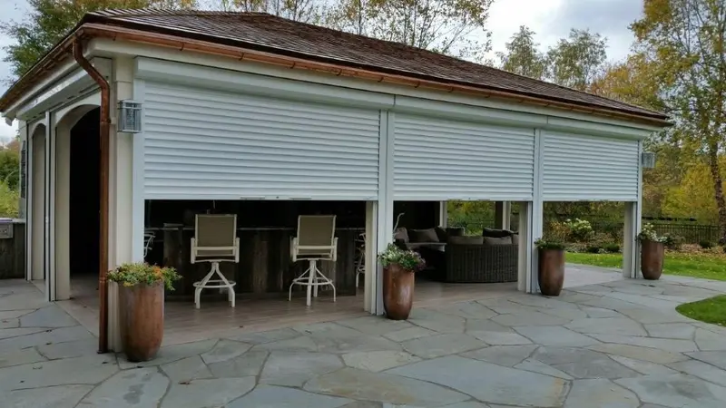 Roll-down hurricane shutters on outdoor pavilion