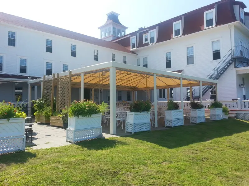Restaurant patio with custom canopy and curtains
