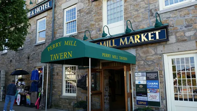 Street view of the Perry Mill Tavern entrance awning beside the Mill Market, Newport, RI