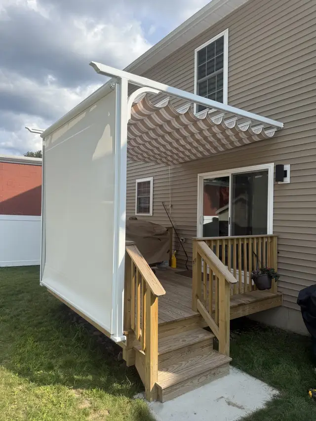 Slide-wire canopy pergola with privacy screen down