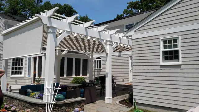 Under the Newport pergola — roll-down solar shade on the side