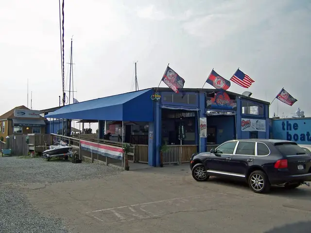 Blue canopy along the waterfront deck at the Riptide marina bar