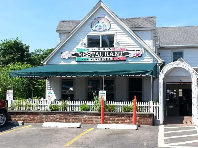 Green scalloped awning across the patio at Aldo's Restaurant on Block Island