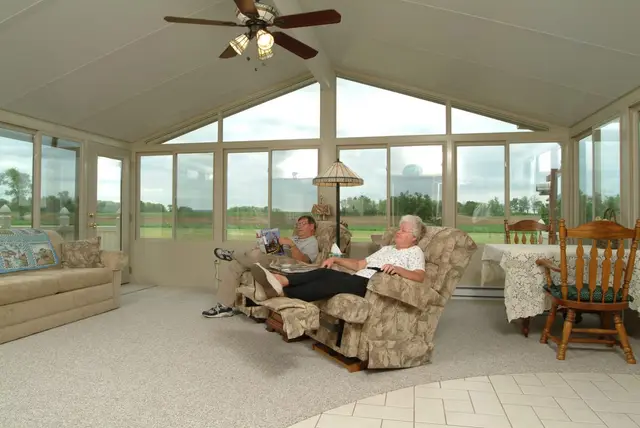 Three-season room interior with recliners, lived in year-round