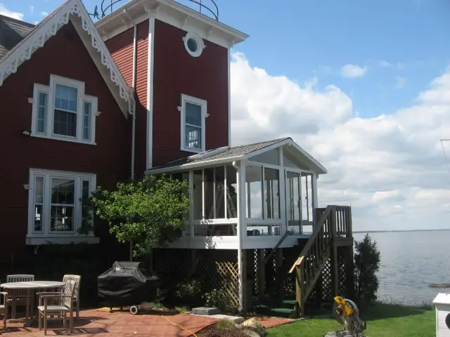 Screened porch room on a lakeside Victorian