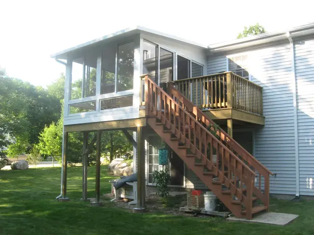 Patio room built beneath a second-story deck and staircase