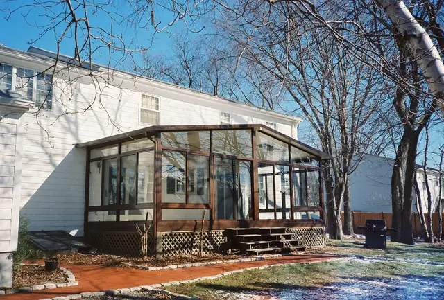 Aluminum patio room on a brick ranch, mid-winter