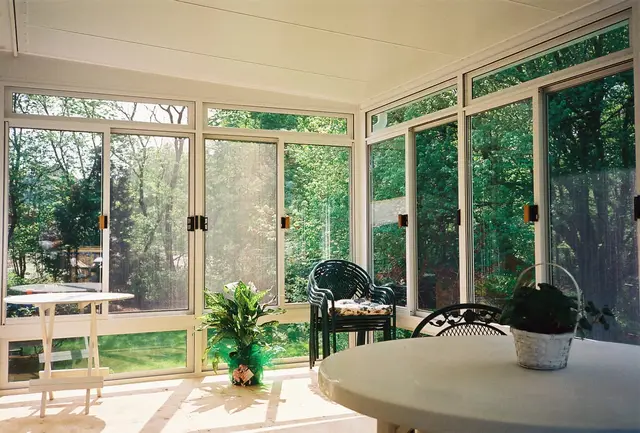 Patio room interior with sliding glass walls