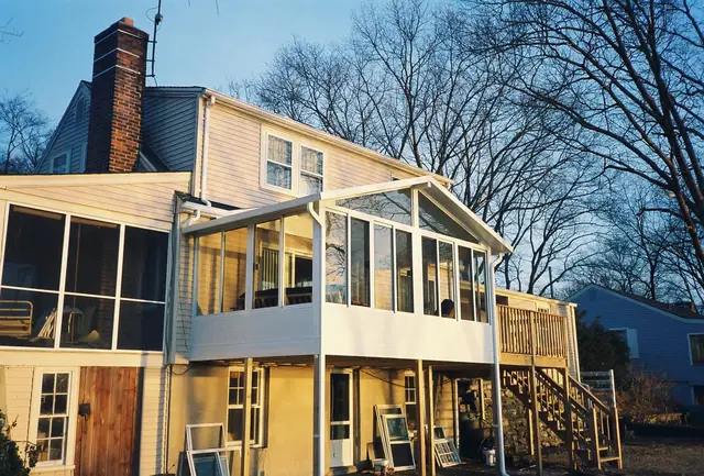 Patio room beneath a rear deck in winter light