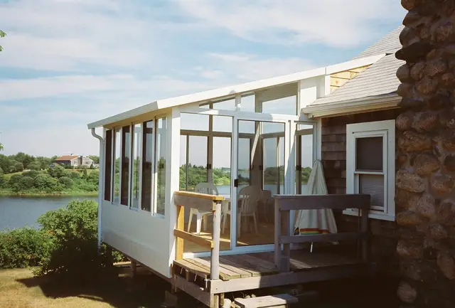 Three-season room overlooking the water