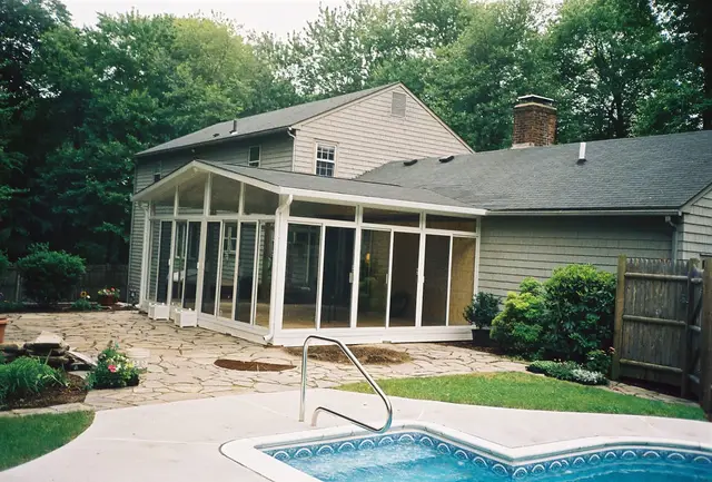 Curved-eave patio room beside the pool