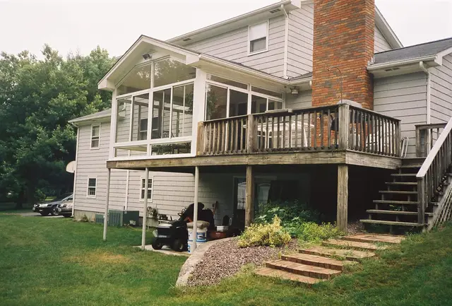 Patio room tucked between deck stairs and chimney