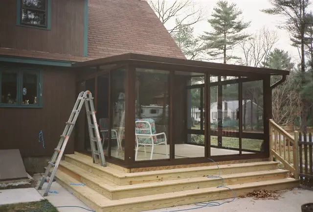 Bronze-frame patio room on install day