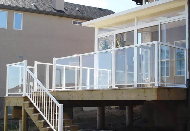 Sunroom with a glass-railed deck