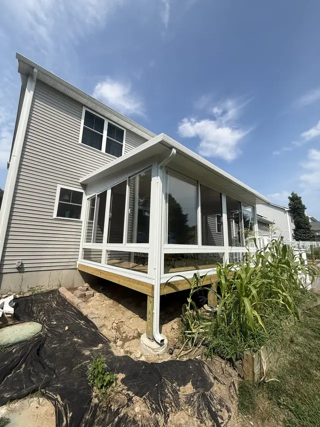New three-season sunroom addition, rear exterior