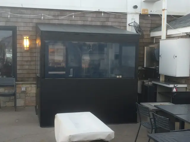 Black vinyl-windowed patio vestibule at the Coast Guard House in Narragansett, RI