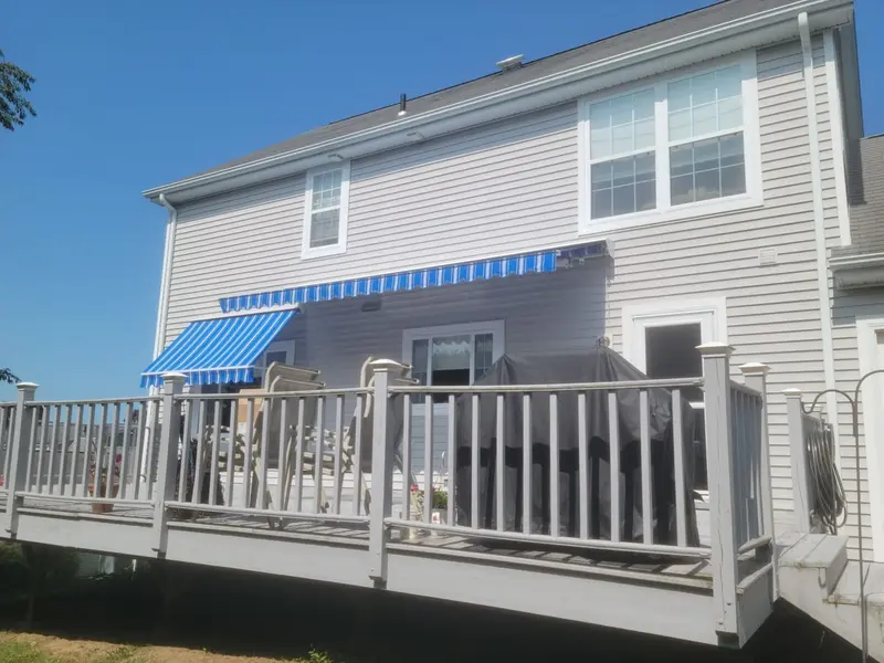 Motorized window awnings on residential home