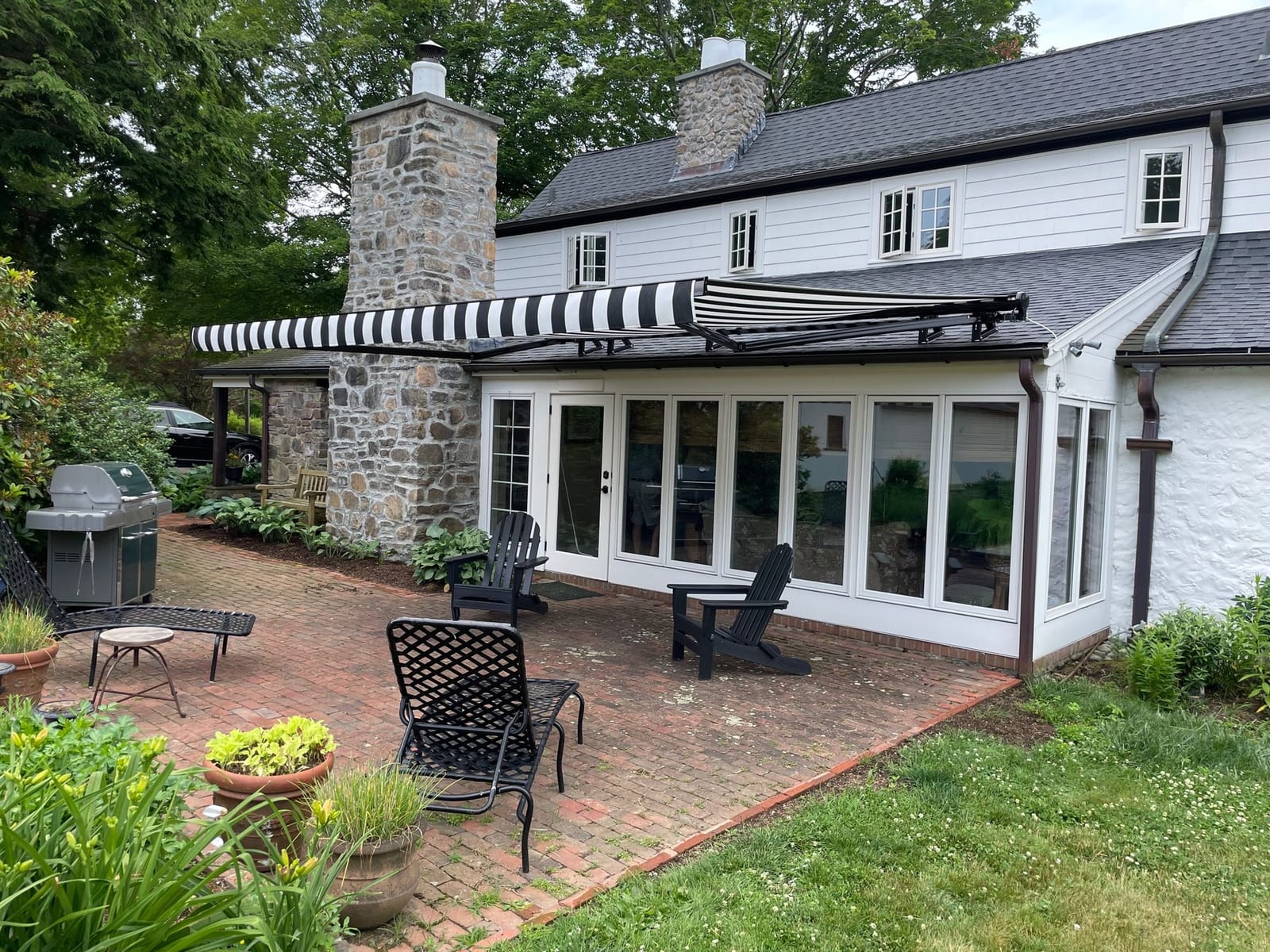 Retractable awning — black toga fabric